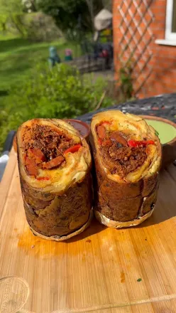 Loaded potato skins burrito with cheese, embodying Tex-Mex comfort food vibes.