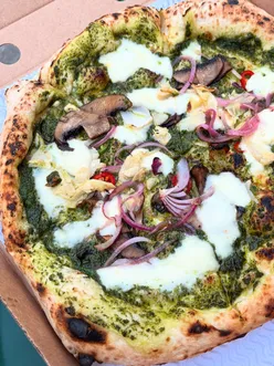 Neapolitan pizza with walnut pesto, fior di latte, chillies, red onion, artichoke, truffle oil mushrooms at The Old Shoe Bar, Sheffield, paired with orange wine and fruity cider.