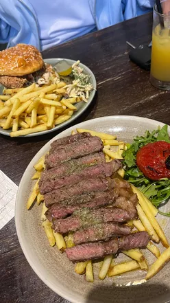 Steak frites with garlic butter, chorizo, and frickles at Whistler on the Green, Glasgow.