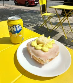 Lemon Squared doughnut with lemon frosting, buttercream, vanilla cake, powdered sugar, paired with Fanta Lemon at Doughnotts West Bridgford.