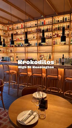 Mediterranean dishes at Krokodilos Kensington: Stone Bass with kiwi, Scallop tartare, Wild Goat with Cretan spaghetti, Greek Salad.