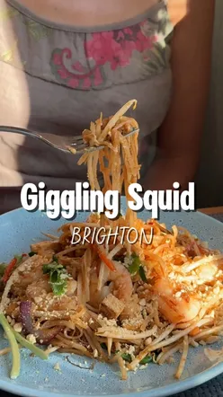 Authentic Thai food at Giggling Squid, Brighton; lamb shank, crispy squid, cozy decor in historic fishing cottage.