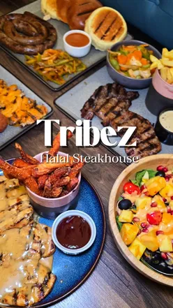 Tribez Steak Grill dishes: flavorful king prawns, zesty mango pineapple salad, rich sausage, juicy chicken butterfly, perfect steaks, refreshing mocktails.