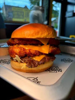 Burgers, loaded fries, sides, desserts, and milkshakes at Shakedown in Edinburgh, featuring pistachio dessert range.