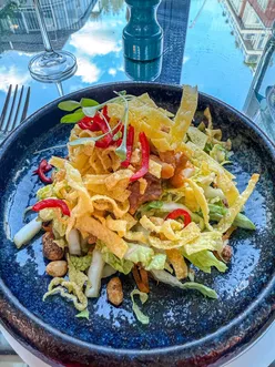 Glamorous Brasserie of Light at Selfridges during London Restaurant Festival, featuring Bang Bang Chicken Salad, Malaysian Prawn Curry, and Summer Blossom dessert with Champagne.