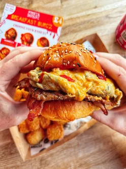 Breakfast burger with egg, bacon, sausage patty, and hash tots from FrieznBurgz, available in Byker and Whitley Bay for £7.