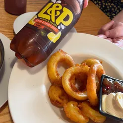 L&P Cafe in Paeroa, New Zealand, famous for L&P onion rings, chicken tacos, loaded fries, and the iconic L&P drink.