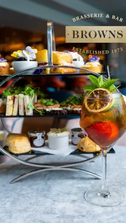 Limited Edition Pimm’s Afternoon Tea at Browns in Marriott, Cardiff; includes finger sandwiches, scones, sweet bites, and Pimm’s.