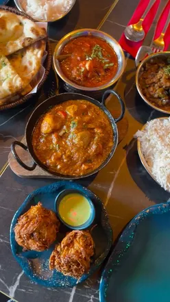 Indian feast at Rangoli, East Prescot Road: chicken madras, Punjabi Karai chicken, bindi masala, garlic naan, mango lassi.