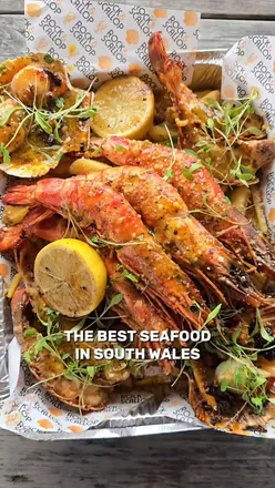 Seafood sharing platter at The Three Golden Cups, Southerndown: lobster tail, XXXL prawns, scallops, surf & turf, garlic butter.