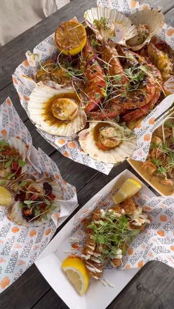 Seafood picnic at The Rock and Scallop, Southerndown: sharing platter with squid, lobster, prawns, scallops, and surf & turf.