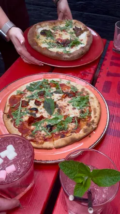 Ibiza Bottomless Brunch at Philharmonic Cardiff with unlimited pizza, prosecco, slushie cocktails, DJs, and rooftop dance floor.