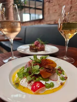 Fine dining at Piccalilli Nottingham: sourdough with butter, burrata with roast peaches, cod with hollandaise, hanger steak, parsnip cake.