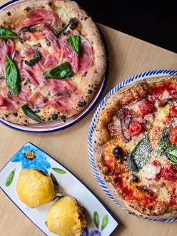 Cresci Pizzeria in York offers authentic Italian Neapolitan pizzas like Hocus Pocus with ground beef, mozzarella, and Parma ham, and Amatriciana with guanciale and pecorino. Enjoy Frittatina Di Bucatini with béchamel and homemade Tiramisu. Pair with Italian beers or Limoncello Spritz.