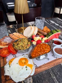 £25 breakfast platter for two at Zouk Tea Bar & Grill, Manchester, featuring brunch items, Desi tea, and mango lassi.