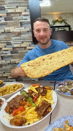Turkish feast at Sen BBQ Newport with lahmacun, humus, full mix kebab platter, lamb chops, lamb ribs, and sweet desserts.