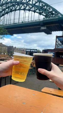 Sunny day at hwkrlandncl with a Parmo burger, homer donut, and dog Cheddar; perfect for weekend drinks in Newcastle.