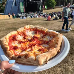 Nduja pizza with hot honey from The Alpine Pizza Co at Forest Live, Cannock Chase; find them at UK festivals.