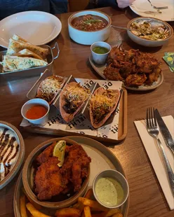 Pulled masala pork tacos, samosa chaat, pyaaz pakora, fish pakoras with masala fries, lamb curry, baingan bharata, chicken rara at Three Swords pub, Horsforth, Leeds.