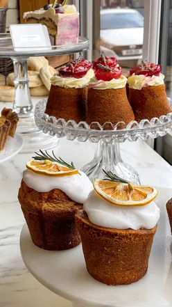 Selection of sweet treats from North East bakeries, including cakes, cookies, and doughnuts from local favorites like PureKnead and Proven Goods.