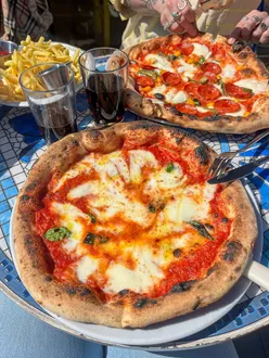 Sanciro's pizza in Leith, Edinburgh, topped with fresh ingredients, showcasing the best local pizza experience.