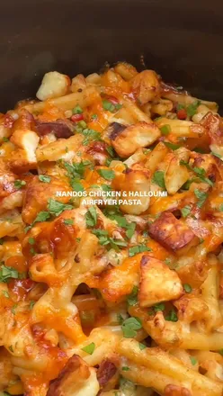 Airfryer Nando's pasta with halloumi, chicken, peppers, and creamy sauce, topped with cheese and sweet chilli jam.