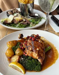Chargrilled pomegranate glazed chicken and seared steak with garlic mushrooms at dog-friendly Herringbone, Edinburgh.