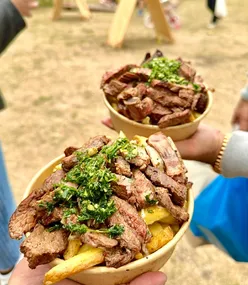 Argentinian BBQ at Ruddington Village Market: Smoked sirloin steak and flat rib on golden fries with chimichurri sauce.