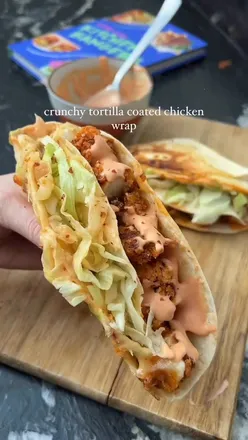 Crispy chicken wrap with Doritos crust, homemade sauce, cheese, and lettuce, pan-fried for a crunchy bite from cookbook sale.