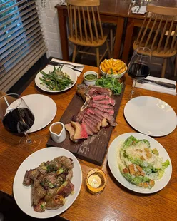 Smoky margarita, peach & burrata, wing steak, smoky Caesar salad, rosemary garlic nocellera olives at Ox Club Leeds.