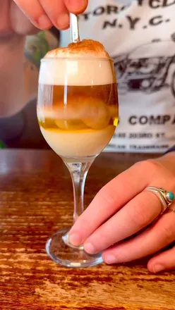 Spanish tapas at Malaga Tapas Glasgow, featuring aubergine with honey, steak dish, and white sangria in a Spanish ambiance.