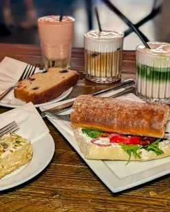 200 Degrees summer menu launch with lemon pistachio blondie, whipped feta sandwich, iced drinks, and city center location.