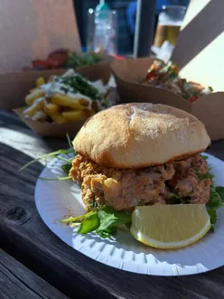 BBQ at The White Lion Cowbridge: lobster roll, steak chips, chicken skewers, cheeseburger, truffle fries, surf and turf chips.