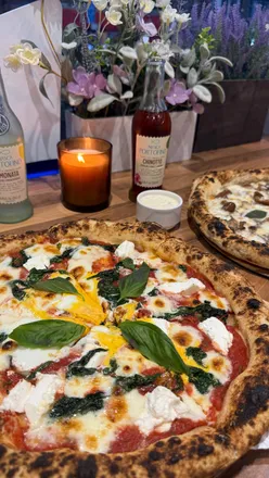 Authentic Italian wood-fired pizzas at Pizza Triangle Sheffield: Fiorentina with ricotta, spinach, egg; Truffle Mushroom with summer truffles.