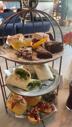 Vegetarian afternoon tea at Nova Scotia Liverpool with salsa buns, hummus crostini, biscoff brownies, and scones.