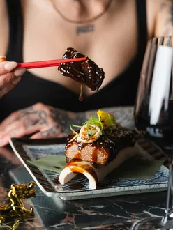 Cherry blossom trees, dark wood, marble floors at Tattu London; steam swirls, cocktail mid-pour, artistic plates captured.