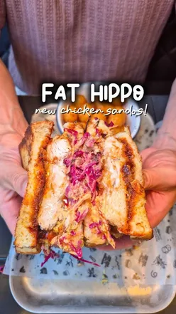 Two chicken sandwiches from Fathippofood: Katsu sando with buttermilk chicken, Togarashi hot honey, Gochujang BBQ, and Caesar sando with creamy Caesar, bacon, in toasted milk loaf.