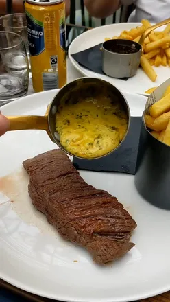 Bavette steak with Koffman fries, cafe de Paris sauce, and wine at Maison by Glaschu, Glasgow. Includes truffled macaroni, garlicky mash, and garlic green beans.