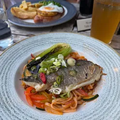 Pan fried seabream with Asian stir fry, udon noodles at dog-friendly Erskine Arms, Conwy near the castle.