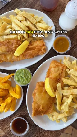 Golden cod and haddock with orange chips at Merchant's Fish and Chips in Bewdley, known for award-winning taste and gluten-free options.