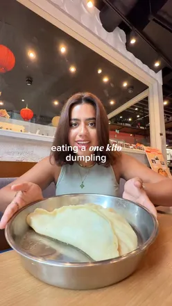 Massive 1 kg dumpling at Xi Home Dumplings, Spitalfields; steamed, pan-fried, 30cm, part of London's Giant Dumpling Challenge.