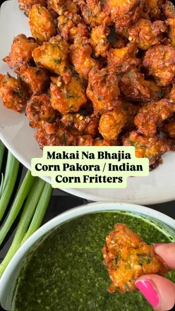 Golden brown Indian corn fritters, Makai Na Bhajia, deep-fried with spices, perfect for garden parties and picnics.