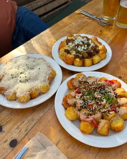 Loaded tater tots, Detroit-style pizza, Caesar salad with burrata, and a spicy non-alcoholic margarita at Ramona, Manchester.