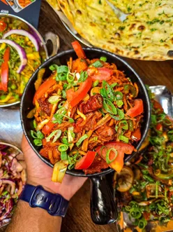 Indian veg dishes at Shiv Sagar, Leicester: Chinese Bhel with crispy noodles, paneer, manchurian; Chef's Special Aubergine; Veg Jaipur curry with papad cone; Rose Falooda drink.