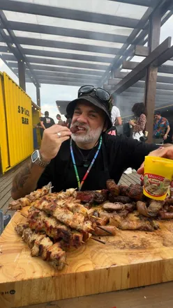 Grilled festival food at Electric Castle by Lidl Romania, featuring BBQ meats and vibrant festival vibes.