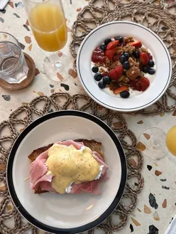Brunch at The Sofia, Mackies Corner, Sunderland with poached eggs benedict, mimosa, live music, and community vibe.