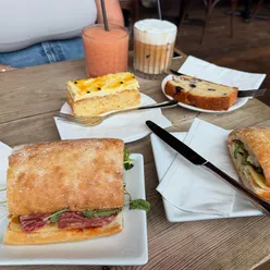 Salami, mozzarella, red pesto sandwich, lemon blueberry loaf, iced flat white, vanilla cold foam at 200 Degrees Barnsley.