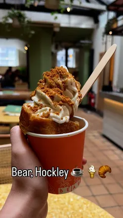 Biscoff Cone with Oatly soft serve in a croissant cone topped with Biscoff sauce at Be More Bear in Hockley, Nottingham.