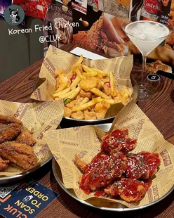 Korean fried chicken at CLUK in Gay Village, featuring crispy wings, spicy beef ramen, and salt & pepper prawns.