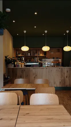 Enjoying coffee and vinyl at Lounge33, a cozy new cafe on Leith Walk, Edinburgh, featuring local bakes and records.